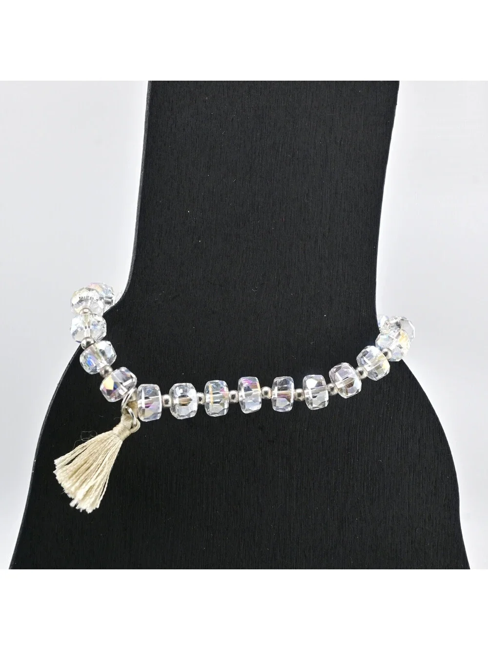 FACETED CRYSTAL STRETCH BRACELET WITH TASSLE